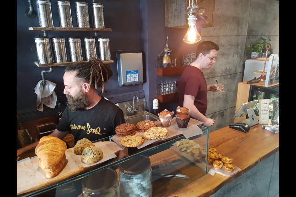 Eddie Mota (left) and son Christian Mota are the faces behind the counter at the newly opened Wired Owl Coffee Company in downtown Barrie. Shawn Gibson/BarrieToday
