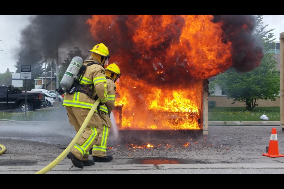 North  Bay firefighters fight a demo-fire in a room without sprinklers