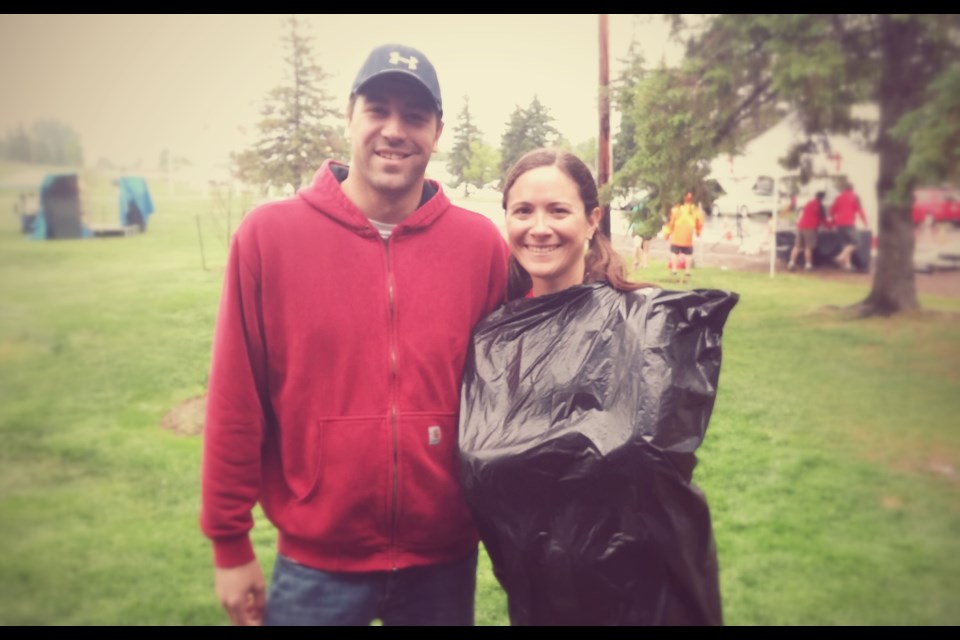 Tina Foster fashioned her own raincoat in anticipation of her 10km run at Patrick 4 Life, Sunday. Tina is pictured with her brother, Gerald Foster, who volunteered at the event, held at Lee Park.