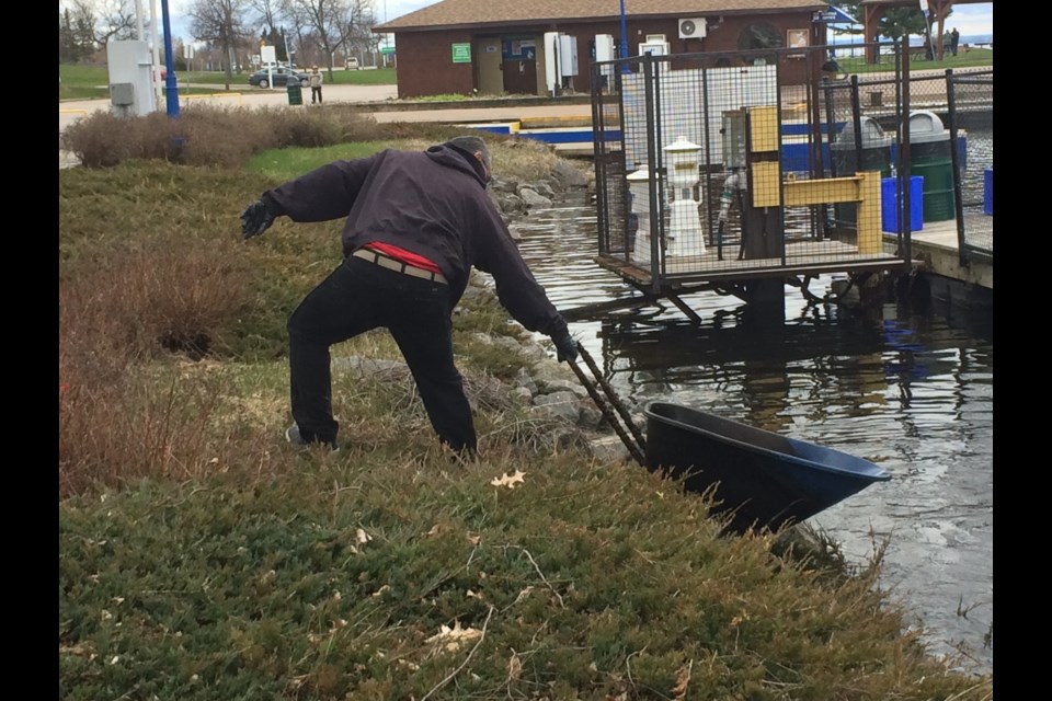 Local Project Aware Coordinator helps remove debris during North Bay Scuba Club marina clean-up at the waterfront last Sunday. 