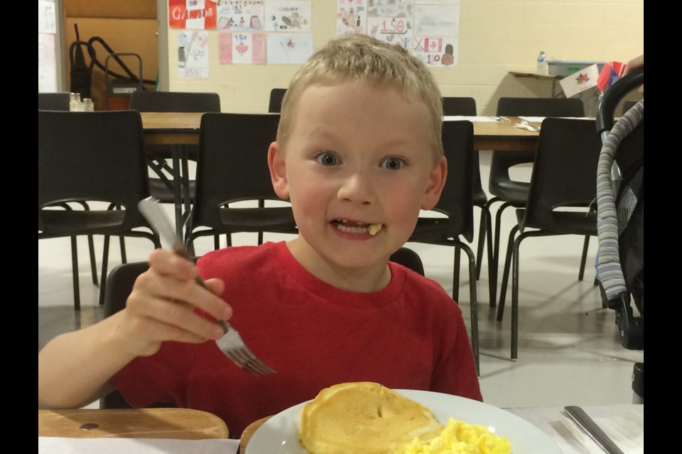 Six-year-old Caleb Houston can't believe how good his Canada Day pancakes taste