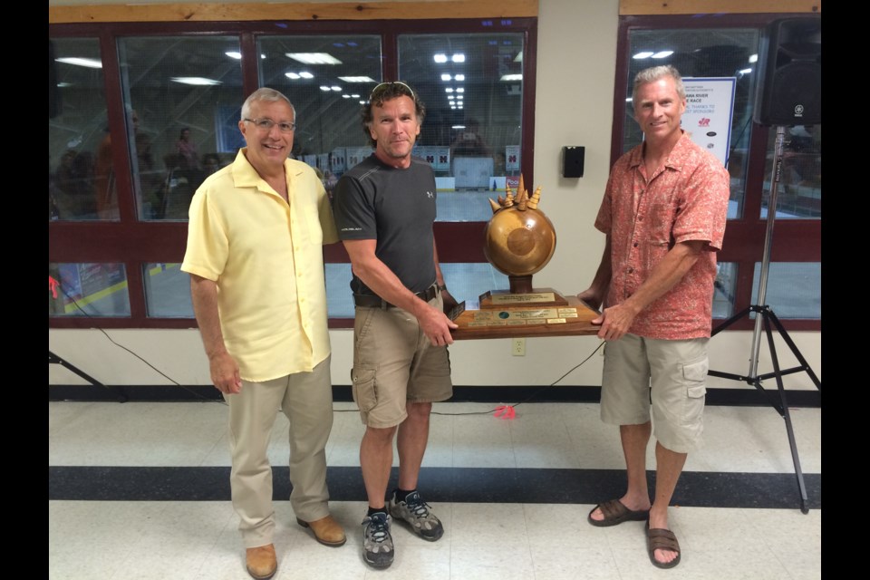 Nipissing MPP Vic Fedeli presents Dean Brown and Mark Clout with the Fastest Overall Time trophy