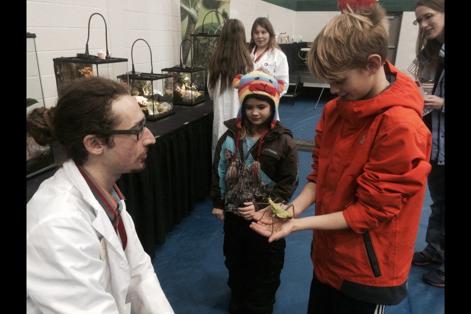 Nathalie and Nathan McCarty get  first hand knowledge about bugs at Science Carnival