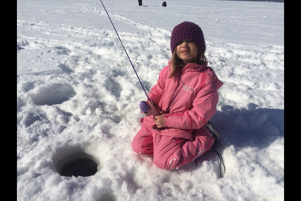 Seven-year-old Lylah Bennett trying to get a nibble at the Ice Fishing for the Cure derby for the Canadian Cancer Society.