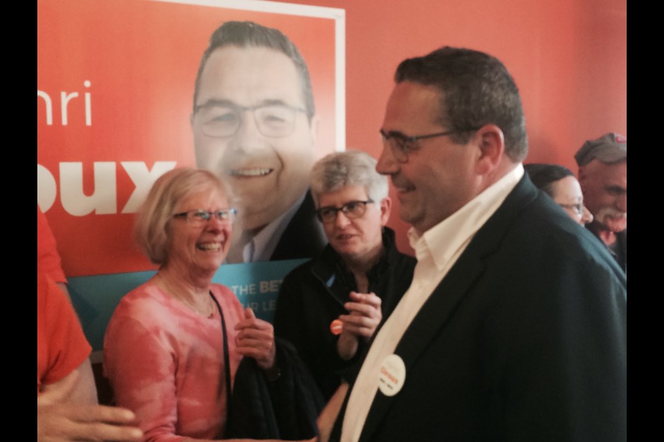 Ontario NDP candidate for Nipissing, Henri Giroux is greeted by supporters at the official opening of his campaign headquarters