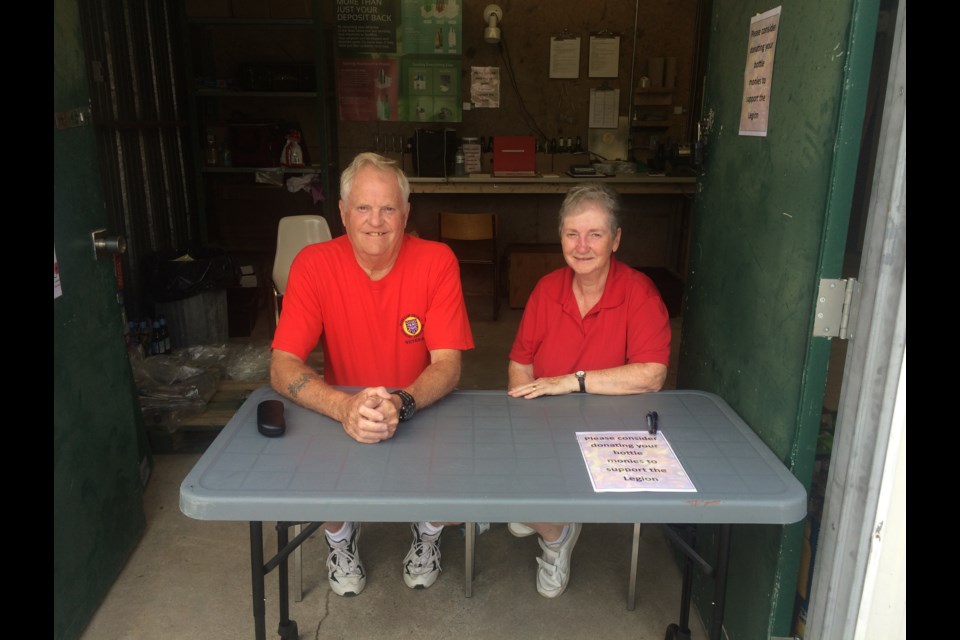 Ron and Eileen Ward volunteer at the Callander Legion empty bottle return depot beside the main building. 