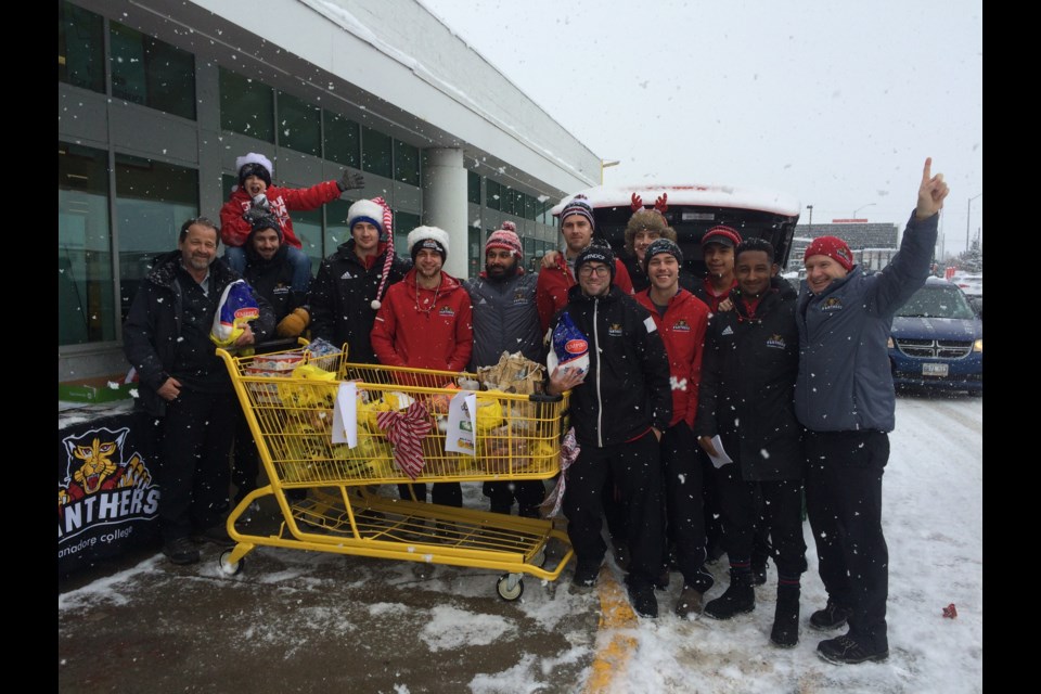 Canadore College Men's Varsity Volleyball Team collect donations for the Gathering Place  