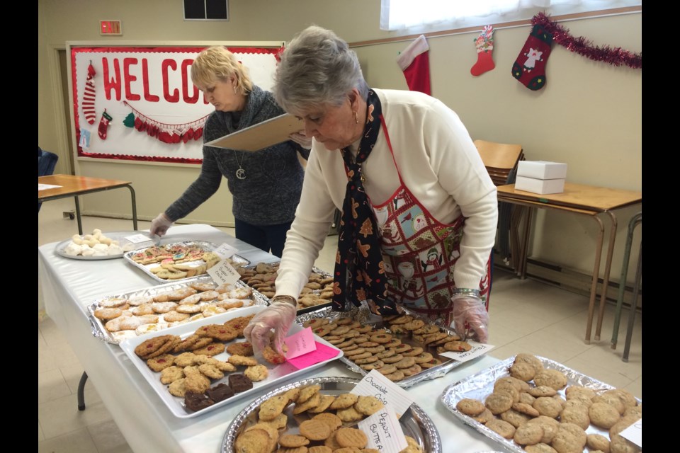 Refilling cookie trays at the 8th Annual Emmanuel United Church Cookie Walk fundraiser