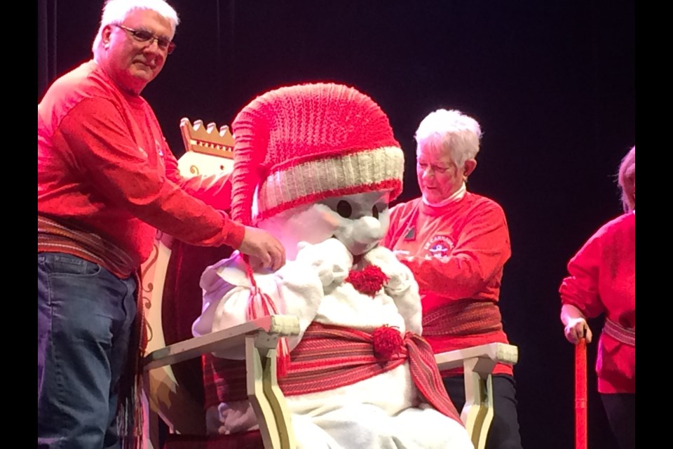 Le Bonhomme Carnaval is revealed at the closing ceremonies Sunday afternoon.