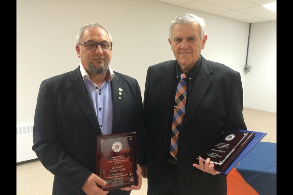 Richard Champagne (l) and Bill Vrebosch honoured for their contributions as former town council members to the Municipality of East Ferris  