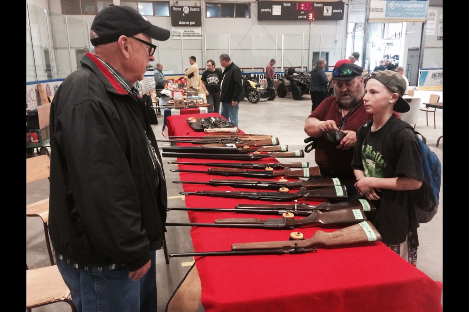 Trapper and hunter Jim Swackakmer adds to his gun collection at the Rock Cut Shooting Club inaugural gun show