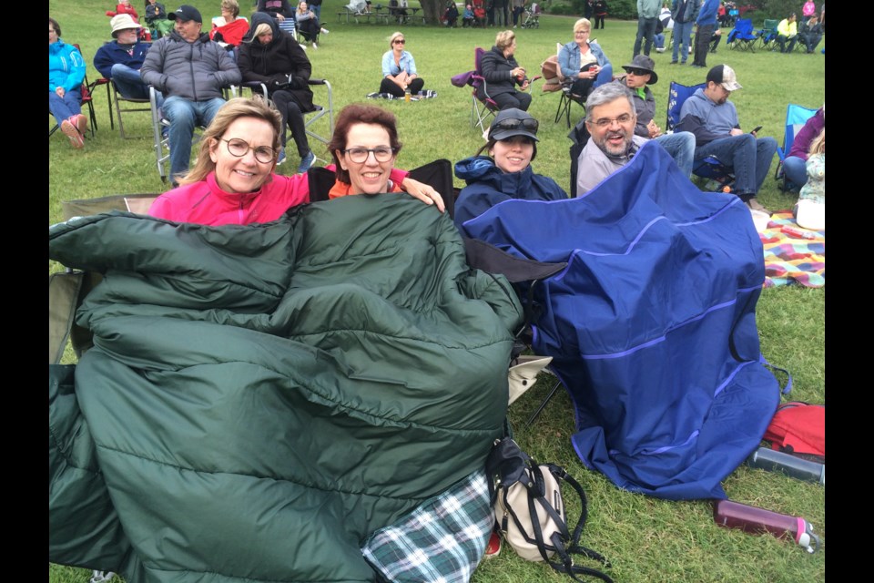 (l-r) Deb Luckett, Lorraine Conway, Sarah Conway and Ralph Dellaquion stay warm to support the band Terrorbirds
