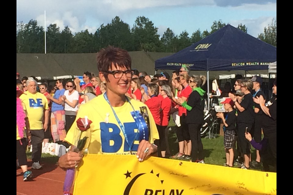 2019 Honourary Survivor Kim Kanmacher leads the  survivor lap at the Relay for Life fundraiser for the Canadian Cancer society at CFB North Bay 
