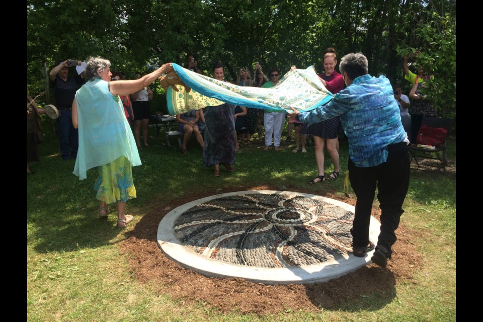Pebble mosaic honouring survivors of sexual violence unveiled