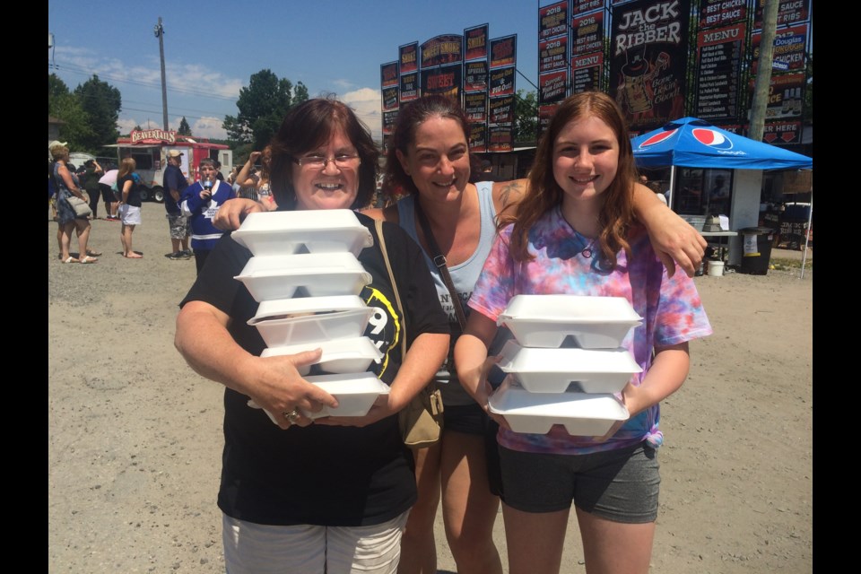 (l-r) Tammy Pozzo, Melissa Pozzo-Brown and Emily Brown stock up at Ribfest