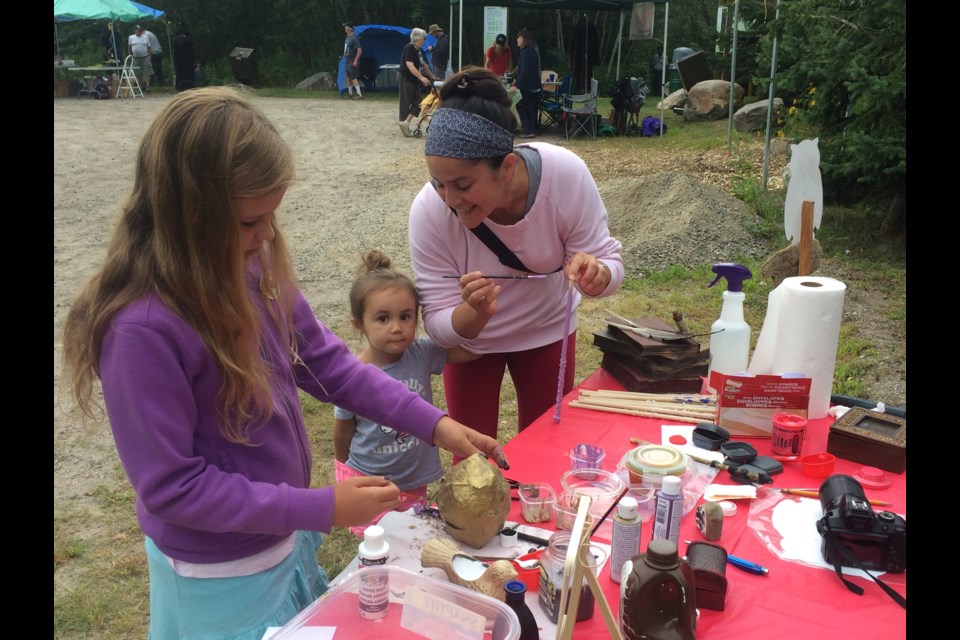 Katelyn Kash (l), Maya Granger, and Sarah Vincent enjoy doing crafts at the 6th annual Louise de Kiriline Lawrence Nature Festival 