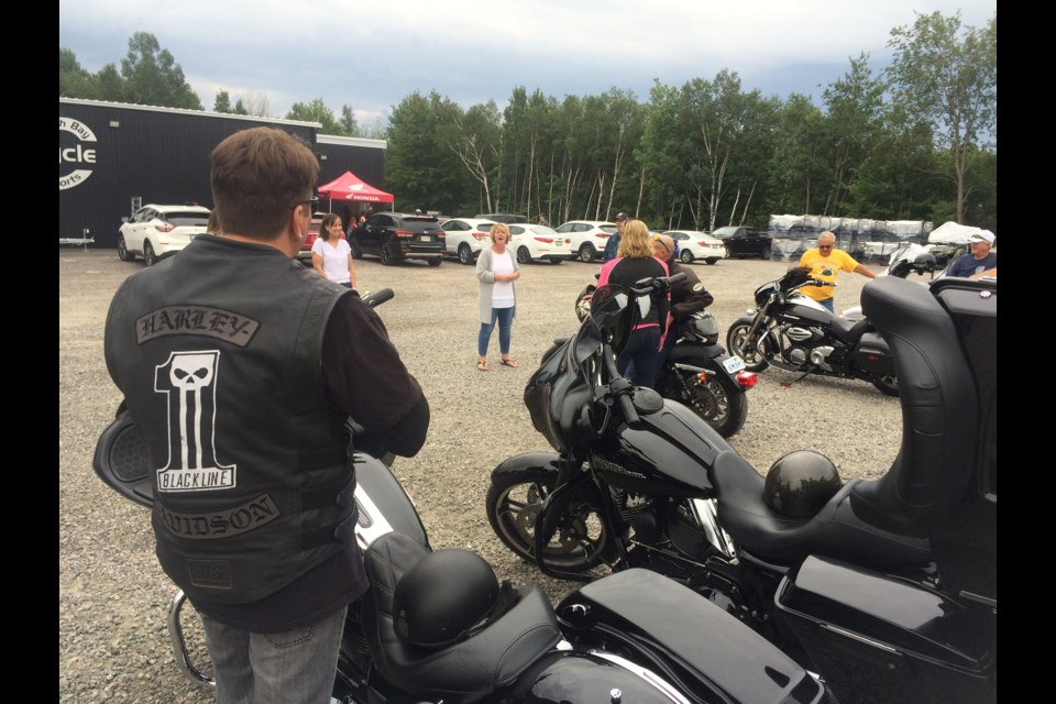 Anna-Marie Aquino (centre) goes over the rules for the inaugural North Bay Cycle & Sports ride for the Cancer Care, Close to Home campaign