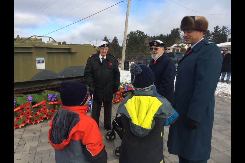 School children interact with veterans at Remembrance Day Ceremony in East Ferris 
