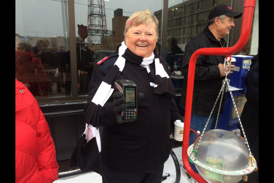 Major Bonita McGory of the North Bay Salvation Army holds up one of five debit machines to be used during its Christmas Kettle Campaign