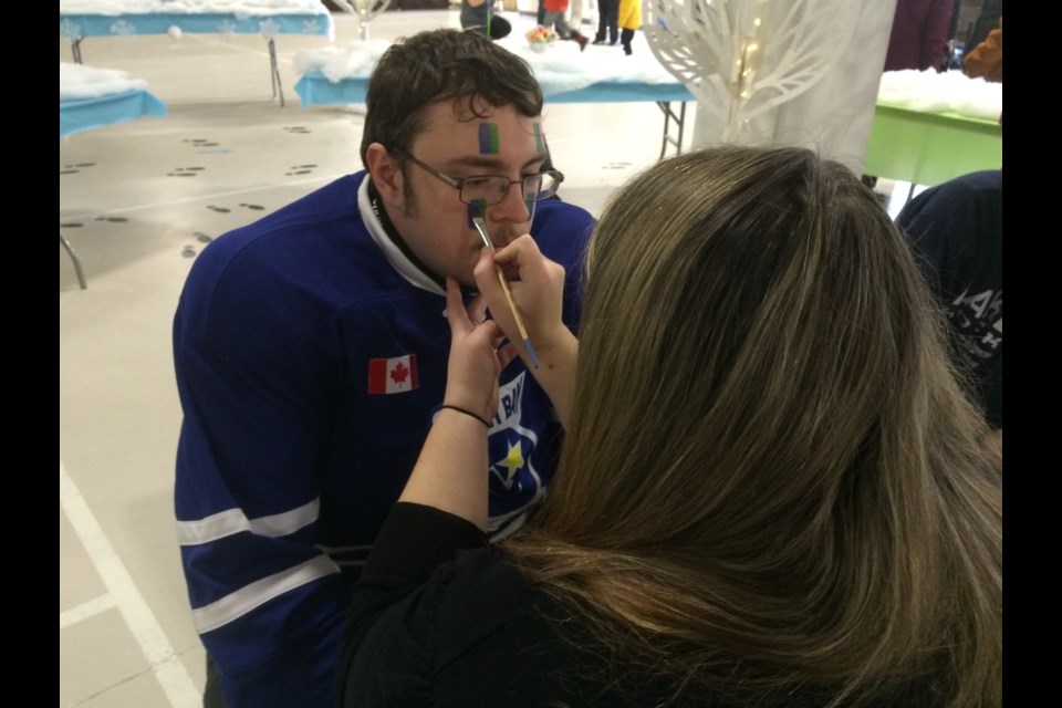 Chris Ouellette takes a break from hockey to get his face painted at the 65th anniversary celebrations of Community Living North Bay