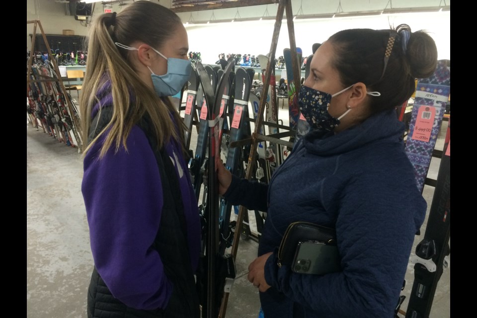 (l-r) Mom Melanie  Chemery        and daughter Chloe look for bargains at the Annual Ski and Snowboard Exchange in North Bay on the weekend.