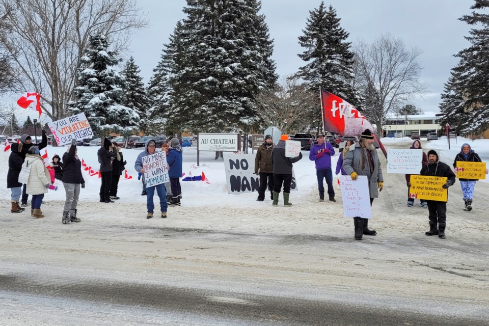 Demonstrators gather outside of Au Chateau in Sturgeon Falls to demand the home's board revise its visitation policy / Photo David Briggs 