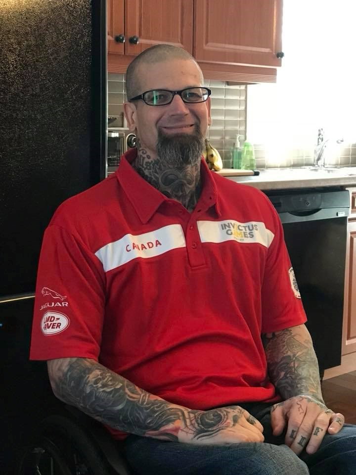Dave Innes poses for his facebook group photo in his Invictus 2018 shirt