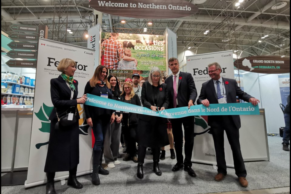 From left, holding the ribbon, are Shelley Peterson, board member and past president of the Royal Agricultural Winter Fair; Patty Hajdu, FedNor minister; Ray Stanton, president of the Royal Agricultural Winter Fair; and Guy Paquette, FedNor's pavilion coordinator.