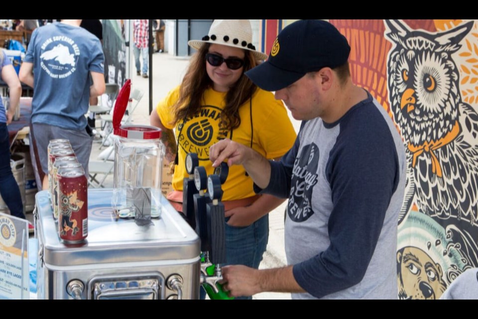 Abby Cook helping out Gateway City Breweries at the Bay Block Party in August 2019. Photo provided by Abby Cook. 