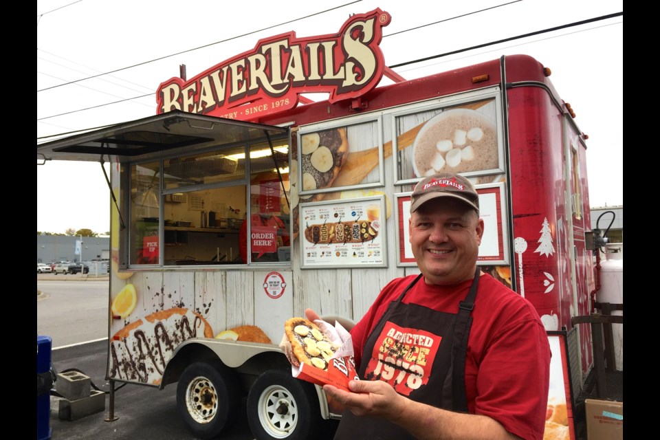 Ray Seguin and his new beavertail trailer.  Photo by Chris Dawson.  