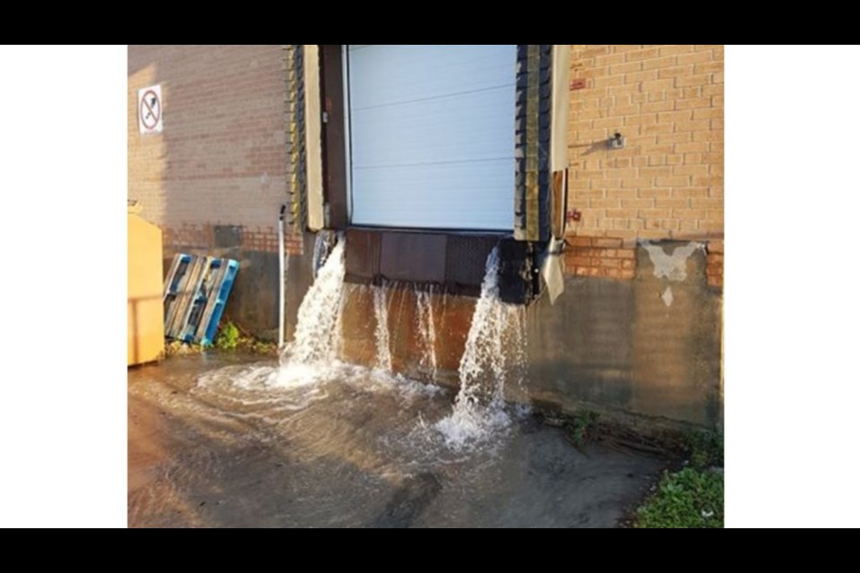 Water gushing out of The Beer Store on Cassells. Courtesy CKAT.