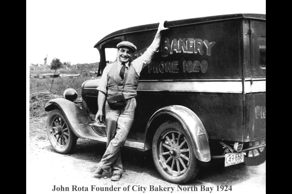 City Bakery founder John Rota with one of his delivery vans. The year is 1929 and the vehicle had front and back brakes for the first time. Photo courtesy Mike Rota.