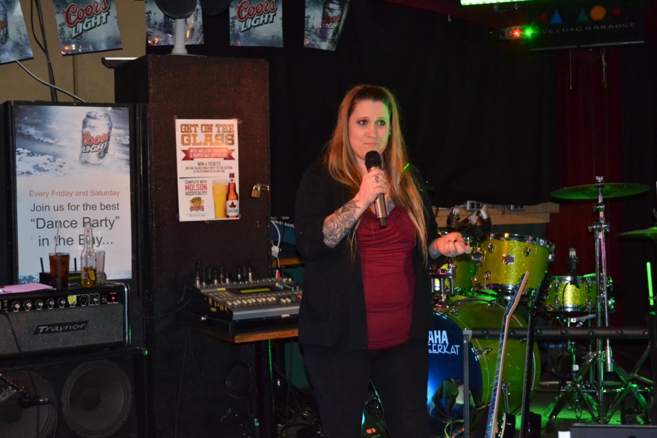 Tessie Martin, thanks the crowd for their support of her husband, Brad, who was injured in a September motorcycle accident and is still hospitalized as a result.  Photo by Robyn Johnson.