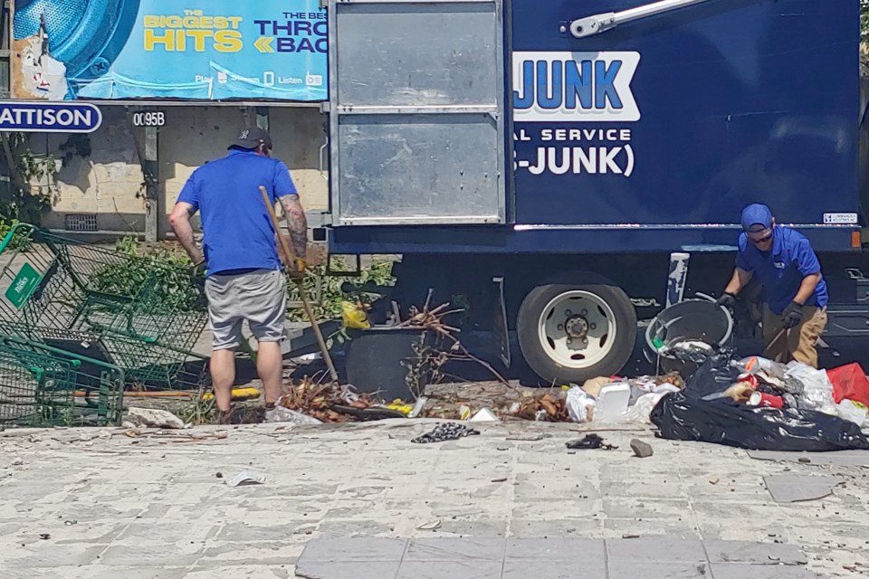 The City of North Bay hired Mr. Junk to clean up the former Midas property at the corner of Main and Fisher.