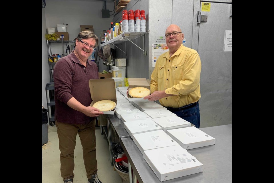 Dennis Chippa acceptes Legion pies from Gord Sunstrum. Linda Holmes/BayToday.