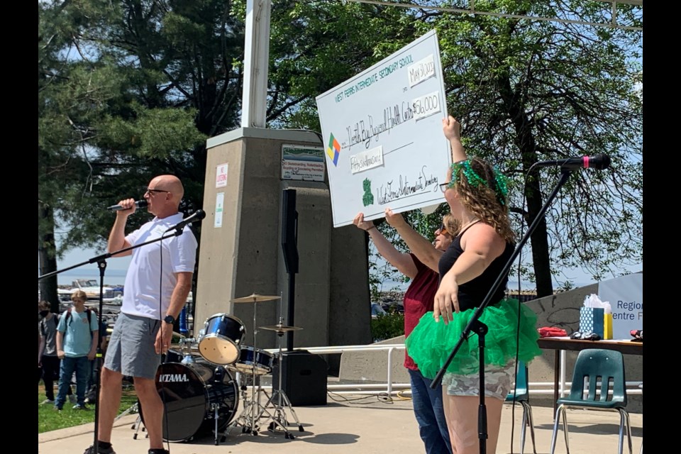 Students hold up the $56,000 big cheque. Photo by Chris Dawson/BayToday. 