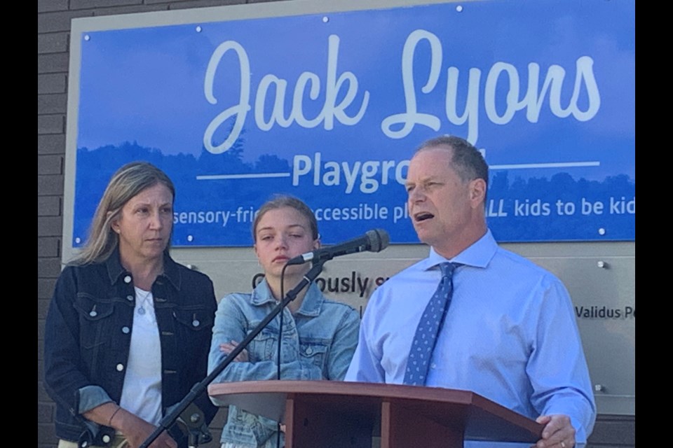 Mark Lyons along with his wife Lesley and daughter Hannah, speak during the Jack Lyons Playground opening.  Photo by Chris Dawson/BayToday. 