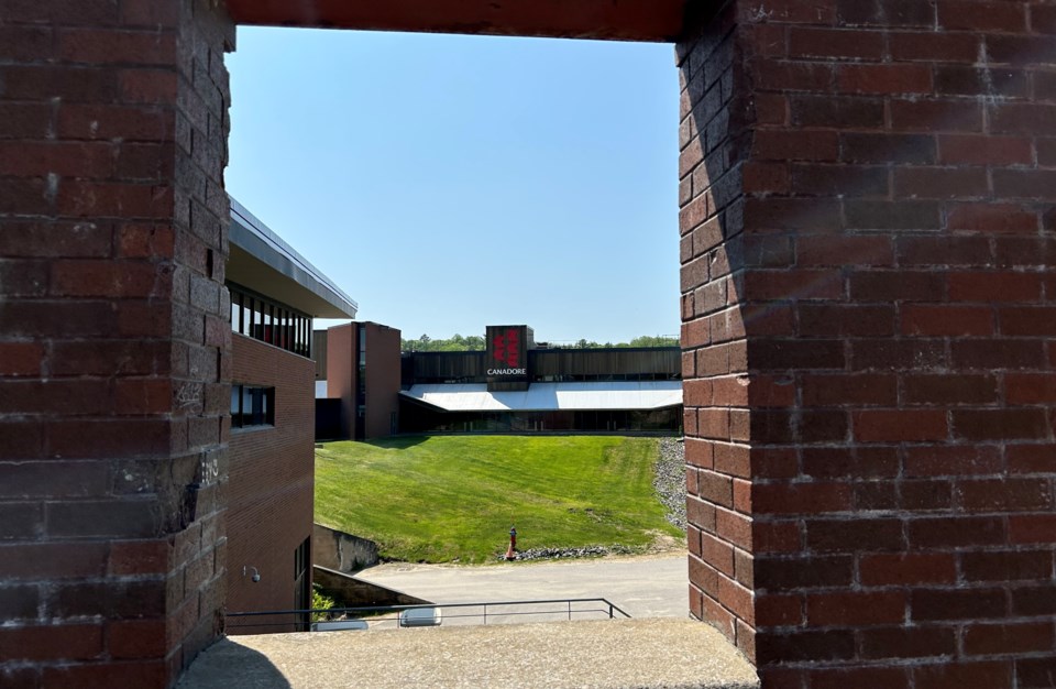 2023-canadore-sign-through-brick-window-turl