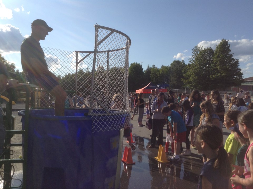 Alain Castonguay, physical education teacher, prepares to be dunked by his students.