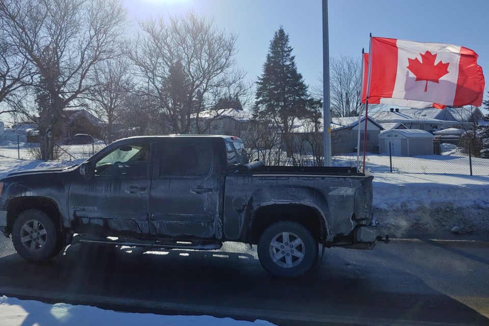 The Canadian flag was embraced as a symbol of the protests by participants.