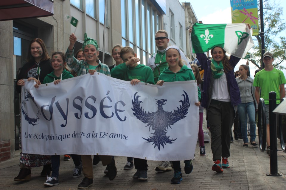 Students from École secondaire publique Odyssée proudly lead the parade across downtown. Photo by Ryen Veldhuis.
