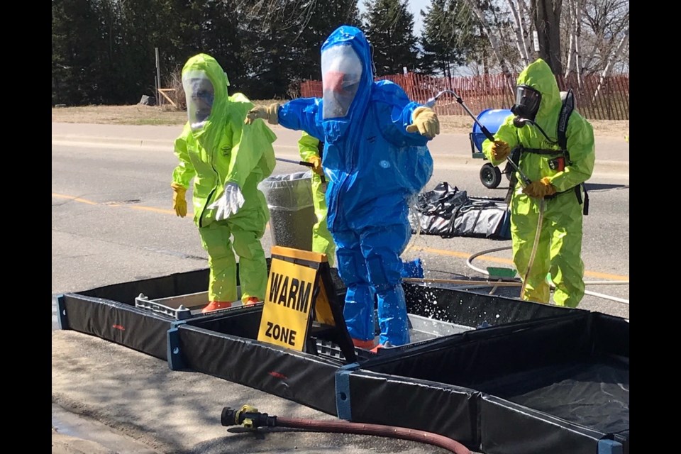 The North Bay firefighters entry team that isolated the chlorine leak consisted of Dave Tessier and Dan Catteau. They donned HazMat suits to contain a chlorine leak yesterday at the sewage plant. Courtesy North Bay Fire Department.