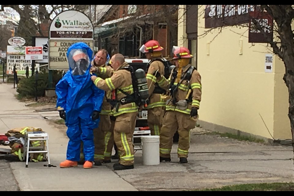 Firefighters in hazmat gear investigate an incident at the post office on Ferguson St. Chris Dawson/BayToday.