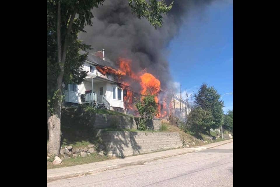 A fire Sunday afternoon in Temiscaming destroyed eight homes. Courtesy Denis Lacourse.