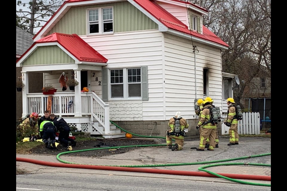 A fire on Algonquin Ave. endangered the lives of multiple pets Wed. morning. first responders work to save the life of one pet on the front lawn. Chris Dawson/BayToday.