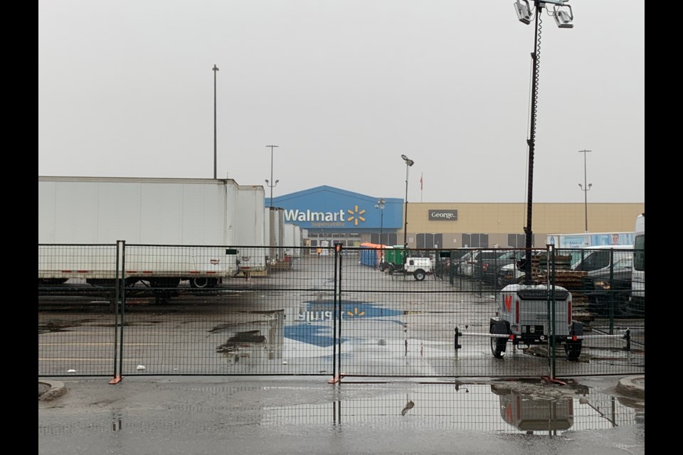 A fence now surrounds the Walmart parking lot filled with trailers holding store merchandise. Chris Dawson/BayToday.