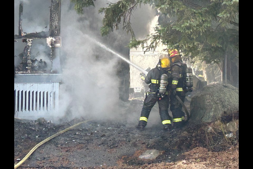 Fire crews battle an early morning fire.  Photo by Chris Dawson/BayToday. 