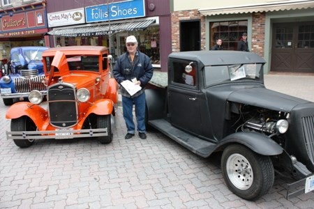 Reg Smith and his 1933 Ford truck (right) and 1931 Ford 1/4 Ton (left)