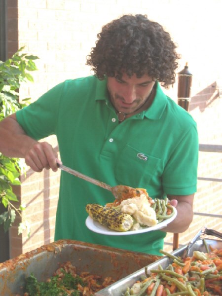 Ethan Zohn loads his plate after finishing his last day of The Last Cull taping. Photo by Phil Novak.