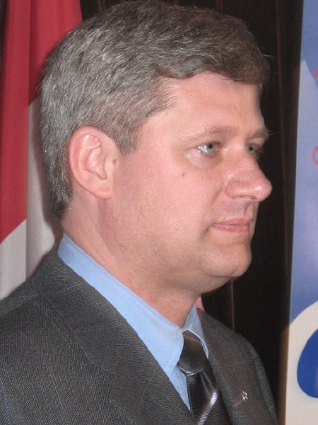 Conservative leader Stephen Harper pauses to absorb the thunderous applause he received while speaking to supporters Thursday at the Clarion Resort Pinewood Park.